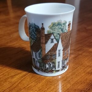 Charming Brown and Green Ceramic Mug with Village Scene
